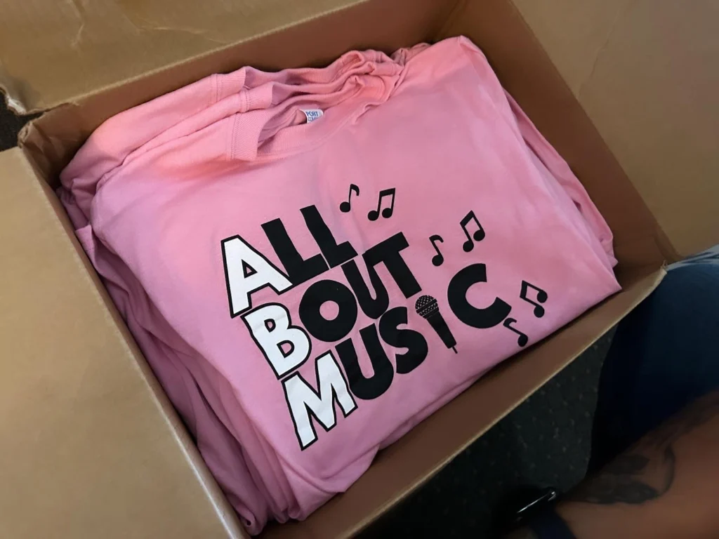 Affordable bulk custom tees printed for local musician